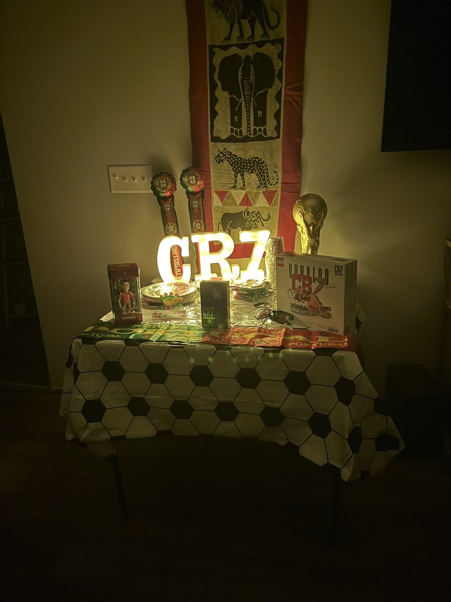 Michelle_Coley's tweet photo. @WorldCupMedia Hoping the cookie cake and CR7/Portugal themed living room I surprised my son with will bring championship luck. #SIUUU https://t.co/Zg5oegNSzI