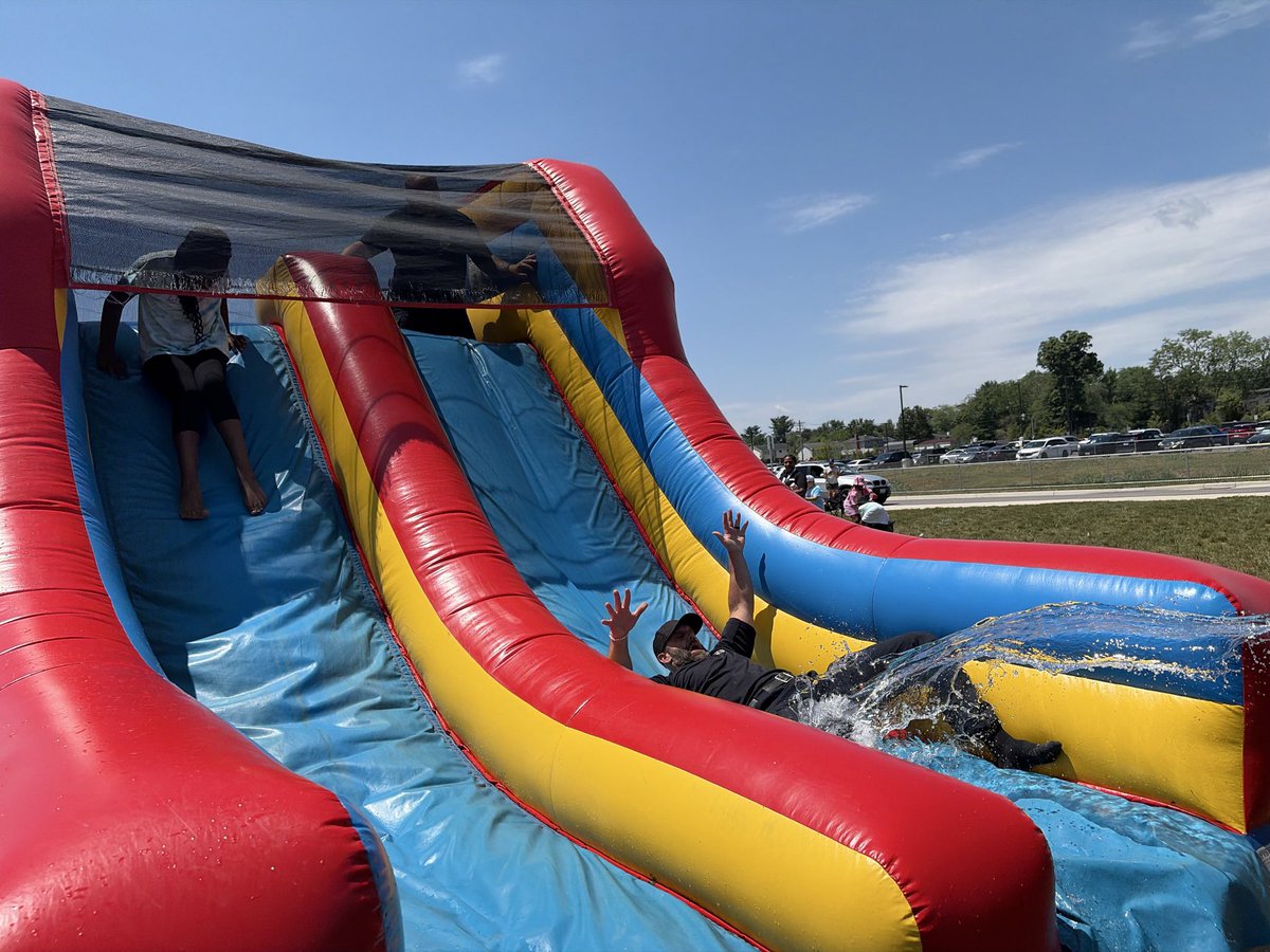 AACOPD's tweet photo. Today, Detectives from the Eastern District Strategic Patrol Team participated in the Rippling Woods Elementary School Field Day festivities. Everyone had a wonderful time, and the water activities were especially popular, helping to beat the heat. Detectives Rohe and Callahan even joined the fun by taking a turn on the water slide.