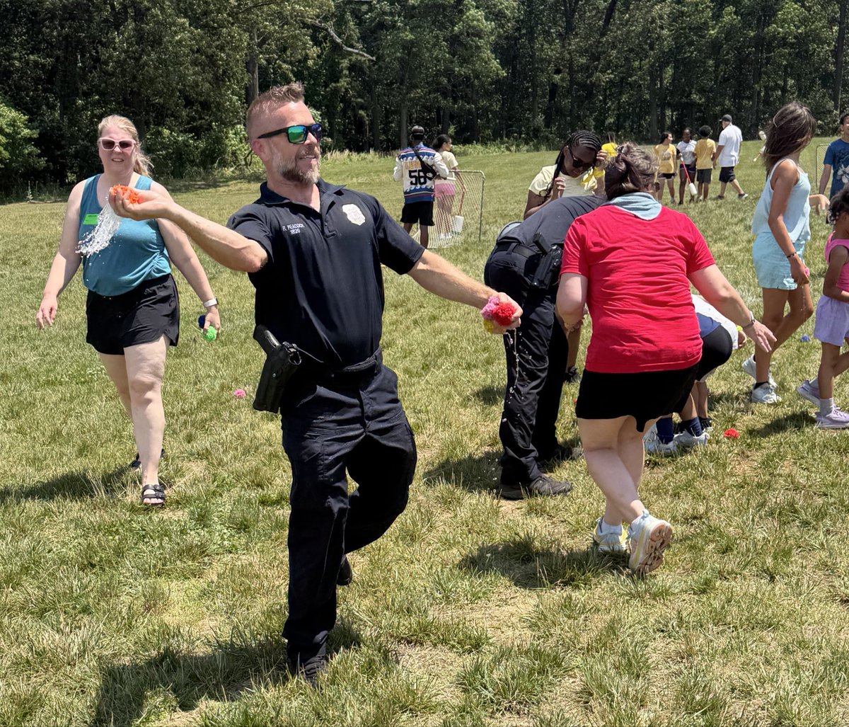 AACOPD's tweet photo. Today, Detectives from the Eastern District Strategic Patrol Team participated in the Rippling Woods Elementary School Field Day festivities. Everyone had a wonderful time, and the water activities were especially popular, helping to beat the heat. Detectives Rohe and Callahan even joined the fun by taking a turn on the water slide.