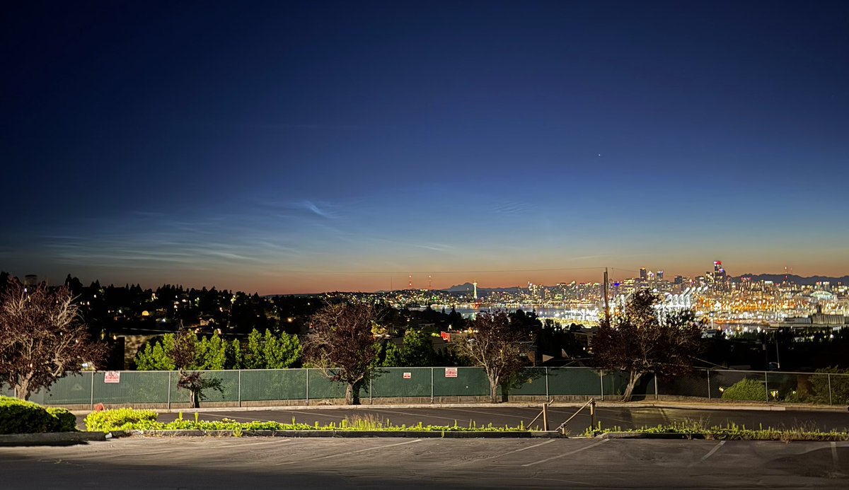 StewarrMark's tweet photo. I can’t believe the noctilucent  clouds are bright enough in Seattle to take a selfie with! Finally getting a career shot and timelapse of nlcs over Seattle and the space needle this morning with @markskaggs10 #wawx #sunrise #spaceneedle @ShannonODKOMO @komonews https://t.co/1ELdq7hhdG