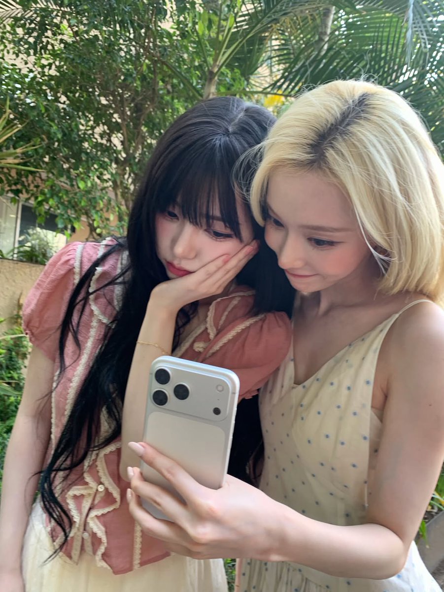 Kariva's tweet photo. [💗🌳✧…] / two besties, inseparable! % @Minjeongt brought her phone and opened the camera, we took a selfie together. from another pov i was so close to her, the breeze cooling us beneath the shady trees in this park. the result? it will be revealed later you will know. https://t.co/zGkJlkVpFJ