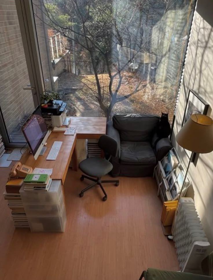 cigarettesummer's tweet photo. This is a good example of making a productive desk space. Notice the hardwood desk, a reading corner, abundance of paper and natural light. You don't need a 3000$ mesh chair and a standing desk. You need a space that you want to be in. https://t.co/6hRnEt2fDs