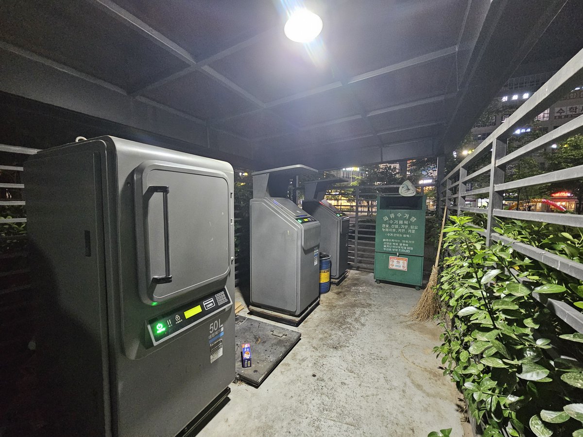 Victorokeke_'s tweet photo. In the city where I live in South Korea, they use these Automated Vacuum Collection systems to manage waste. They are found in street corners and residential estates. You tap your card to open a metal door and deposit trash.

Once deposited, the waste is transported through underground pipes to a central facility.

The system uses RFID chips to record each household's contribution to ensure proper tracking and billing. Households are charged based on the weight or volume of waste they dispose of.
