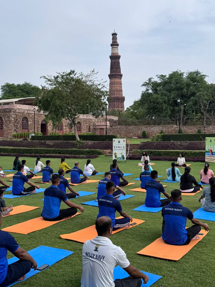 INS_India_IN's tweet photo. As a part of the celebrations of #InternationalDayOfYoga2026, a rejuvenating Nature Walk & Yoga Session was conducted for naval personnel and families at the historic Mehrauli Archaeological Park. 

Around 80 participants enjoyed the serenity of nature, fresh monsoon breeze, heritage architecture, and a vibrant yoga & meditation session against the magnificent backdrop of Qutub Minar. The morning was filled with energy, mindfulness, and well-being under the guidance of experienced yoga instructors
 
#IDY2026 #YogaDay #NatureWalk #Meditation #Wellness #joinindiannavy