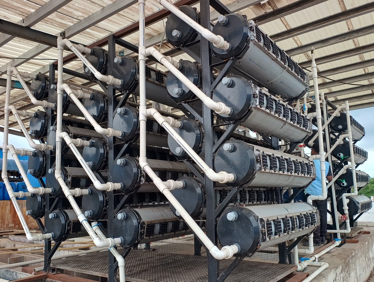 iamvarunguru's tweet photo. This Chennai-based startup cleans wastewater.

And also generates electricity.

This is JSP Enviro.

They've developed a technology called BEADS (Bio-Electrochemical Anaerobic Digester System).

And this is based on microbial fuel cells.

In simple terms, they use special bacteria which can eat the pollutants inside the wastewater.

When these bacteria breaks down the waste, they also release electrons.

And BEADS captures some of those electrons using electrodes placed inside the system.

And that flow of electrons is what creates electricity.

Now, the electricity generated is not a lot.

But the most impressive part is - it doesn't require any chemicals, the process is carbon neutral, results in negligible sludge and it even cuts down operational costs by up to 50%.

And that's huge.

Because right now,  India generates about 72 billion liters of sewage per day.

That's enough to fill nearly 29,000 Olympic sized swimming pools - every single day.

So, if JSP Enviro can scale their solution - it could help solve India's wastewater problem.