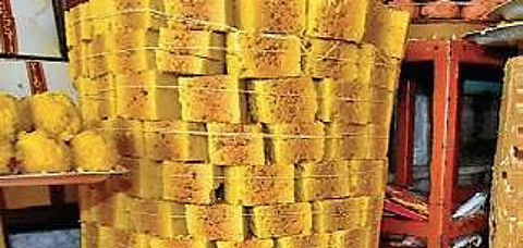 Fintech03's tweet photo. While most people know the delightful baseline story that Mysore Pak was created in the 1930s by the royal chef Kakasura Madappa for Maharaja Krishnaraja Wadiyar IV... the deeper culinary science, the etymology & the ancient textual connections to this legendary sweet run far deeper.

When we strip away the modern commercial adaptations & look at the traditional, porous version (Gulla/hard Mysore Pak), we find a marvel of indigenous food science & a lineage connected to ancient Indian culinary treatises.

Here is the deeper, lesser-known & deeply fascinating history behind the "King of Sweets."

Before diving into its true roots, we must 1st put to rest a bizarre, revisionist claim floating around armchair food circles: the myth that Mysore Pak is somehow a Mughal/Afghan imperial import derived from a sweet called Monsur. This is a classic case of backwards historical gymnastics. While Eastern India does have a look-alike confection, the actual chemistry of flash-frying pulse flours inside high-temperature sugar-fat solutions is a native Sūpa-Śāstra (legume cookery) tech that predates Islamic entry into the subcontinent by centuries. 

To attribute a dessert born out of Southern India’s rigorous temple-palace culinary lineage to Delhi’s imperial courts entirely ignores the indigenous thermodynamic evolution of South Indian sweet-making :))

Many assume "Pak" is just a shorthand/a corruption of the word pack (as in a packed block). It is not. The word is deeply rooted in ancient Sanskrit culinary texts:

- In ancient Indian texts like the Nala Pākaśāstra (attributed to King Nala, considered the 1st master chef of Indian lore) & the Kshemakutuhala (a 16th-century culinary text), Pāka means the precise science of cooking, boiling/reduction. Specifically, it refers to the art of creating sugar syrup (Sharkara Pāka).

- Ancient Indian confectioners classified sugar syrup into highly precise structural phases based on its viscosity (similar to modern candy-making stages like soft ball/hard crack). To make a perfect Mysore Pak, the chef had to catch the Pāka at an exacting string consistency. The name is literally a tribute to the ancient Indian science of sugar mastery.

The classic, traditional Mysore Pak is not the smooth, soft, wet-ghee blocks popular today. It is rigid, highly porous, pale on the outside & a deep, caramelized brown at the center. The physics behind those holes is incredible.

When Kakasura Madappa 1st rushed to create this dessert because he lacked a sweet dish for the King's royal platter, he accidentally triggered a violent thermodynamic reaction: He took roasted chickpea flour (Besan) & added it to boiling sugar syrup, then poured ladle after ladle of smoking hot, bubbling ghee into the mixture.

Because the ghee was hotter than the boiling point of the water trapped in the sugar syrup, the moisture instantaneously vaporized into steam. As the steam desperately tried to escape the thickening, cooling gram flour matrix, it carved out micro-tunnels.

As it cooled, these tunnels solidified, creating a light, aerated, honeycomb structure. When we bite into a traditional Mysore Pak, it crumbles effortlessly because we are literally chewing through captured pockets of historical steam.

If we cut open a flawlessly executed, authentic Mysore Pak, it features a distinct dark-brown core wrapped in a golden-yellow outer crust. This is not from using 2 different batters; it is a manifestation of delayed heat retention: When the boiling mixture is poured into a deep wooden/metal tray to set, the outer layers cool down rapidly upon contact with the air & the tray walls, locking in the yellow color of the gram flour. However, the center remains incredibly hot, insulated by the outer crust. 

The trapped heat continues to gently bake & caramelize the sugar & proteins (Maillard reaction) at the core long after it has been poured. Achieving this dual-color core w/o burning the sweet is the ultimate test of an expert cook's intuition.

A few people associate Mysore Pak with Tamil Nadu is because of Coimbatore.

The traditional, original Mysore Pak from the Amba Vilas Palace is hard, porous, crumbly & pale yellow-brown with a honeycomb structure inside. It requires heavy biting.

However, in 1948, a sweet-maker named N.K. Mahadeva Iyer in Coimbatore, Tamil Nadu, started a shop called Sri Krishna Sweets. He spent yrs experimenting to alter the thermodynamics of the traditional recipe. He dramatically increased the ratio of ghee, changed the heating timing & essentially invented the ultra-soft, silky, melt in the mouth version that we know today, rebranding it as Mysurpa.

Sri Krishna Sweets marketed this version so brilliantly across the globe that for 2 generations of people (especially outside South India), the silky, smooth, ghee-dripping block became the default definition of the sweet.

Geographically, historically & legally, the sweet belongs 100% to Mysuru, Karnataka. The descendants of the original palace chef, Kakasura Madappa, still run Guru Sweet Mart on Sayyaji Rao Road in Mysuru, selling the authentic, porous, crumbly king of sweets.

Tamil Nadu did not invent the sweet, but its brilliant culinary entrepreneurs re-engineered the texture & popularized a soft variety that conquered the modern sweet market. It is a classic case of Karnataka inventing the tech & Tamil Nadu shipping a highly successful software update.