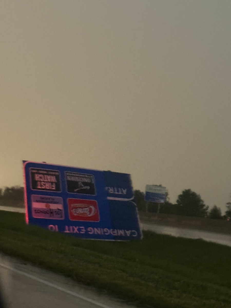 BNSangamon's tweet photo. Trees down and signs bent over and leaning power poles (along with outages) in the vicinity of Kansas City International airport @NWSKansasCity #mowx https://t.co/81o1NmYeml