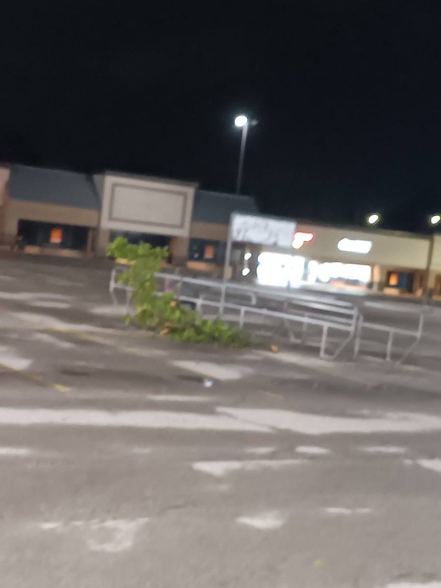 CooperPoitras's tweet photo. @NWSKansasCity This is what I captured leaving work around 11pm in Liberty. The second picture is actually a cart return that got blown around due to the strong winds. https://t.co/PxDYSsZxyX