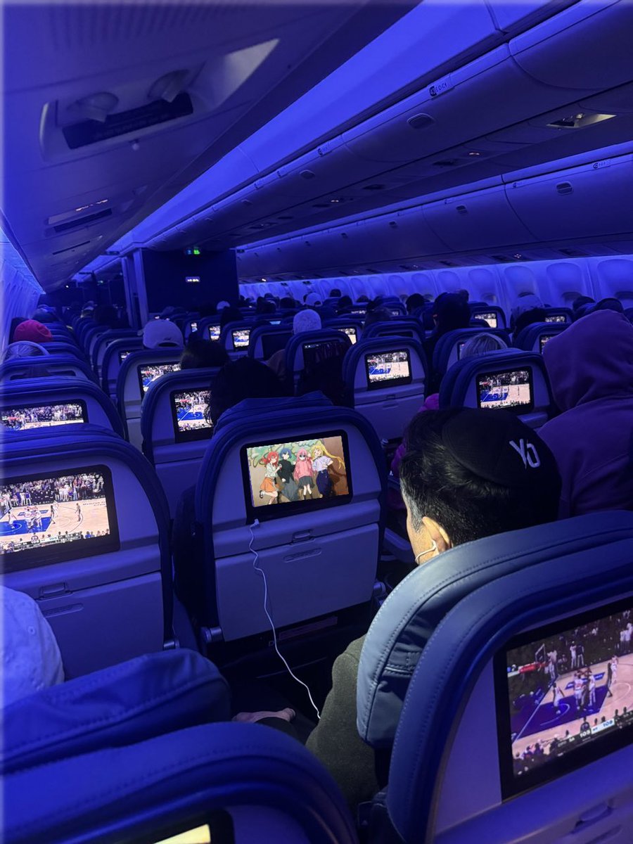 sophologist's tweet photo. whole plane watching the knicks game except for one dude watching bocchi the rock https://t.co/YVXKpXb4JQ