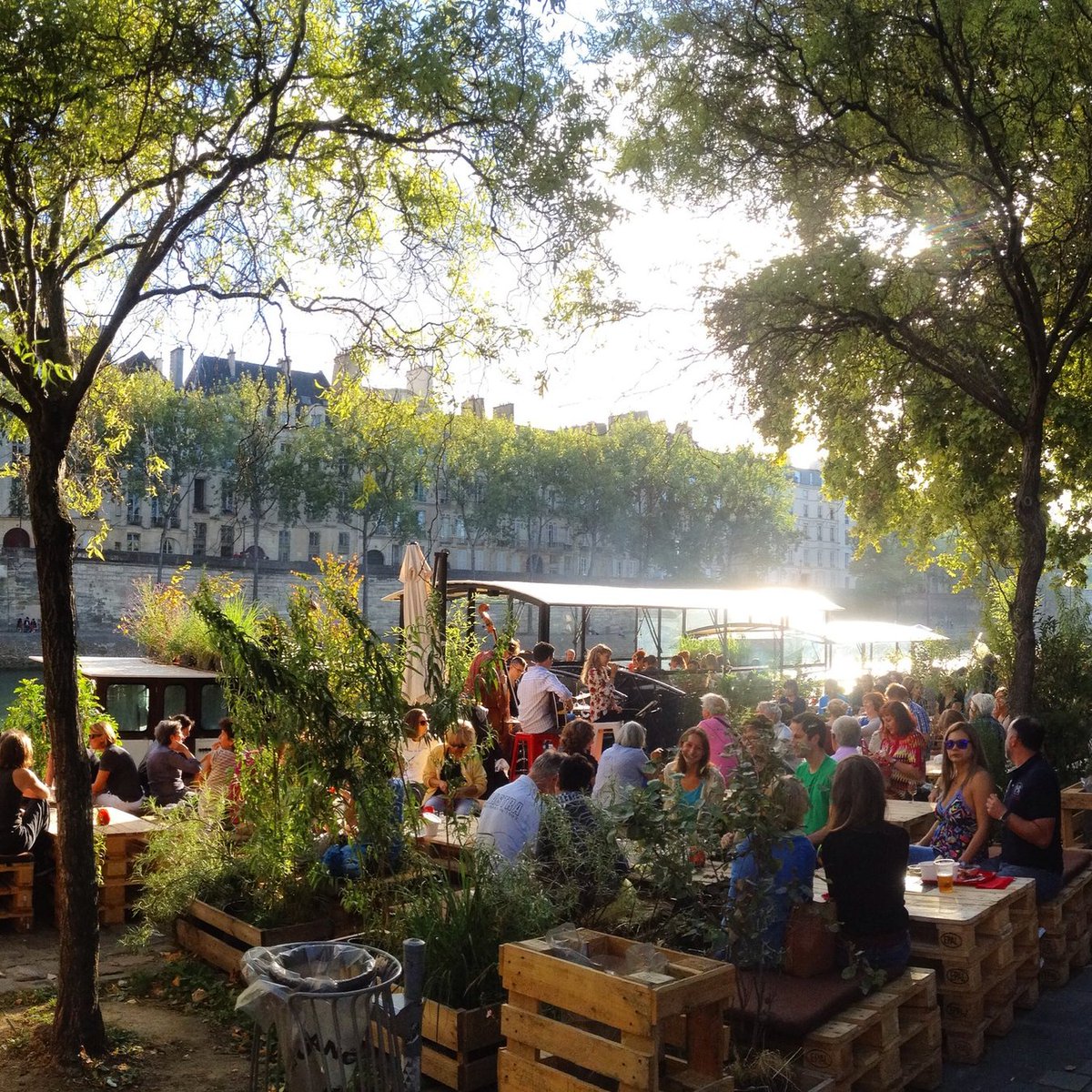 ParisDiscovered's tweet photo. Paris in summer is basically this. Find water, find people, stay until dark. #ParisSummer #SeineParis #ParisDiscovered https://t.co/XjrM1zZDhj