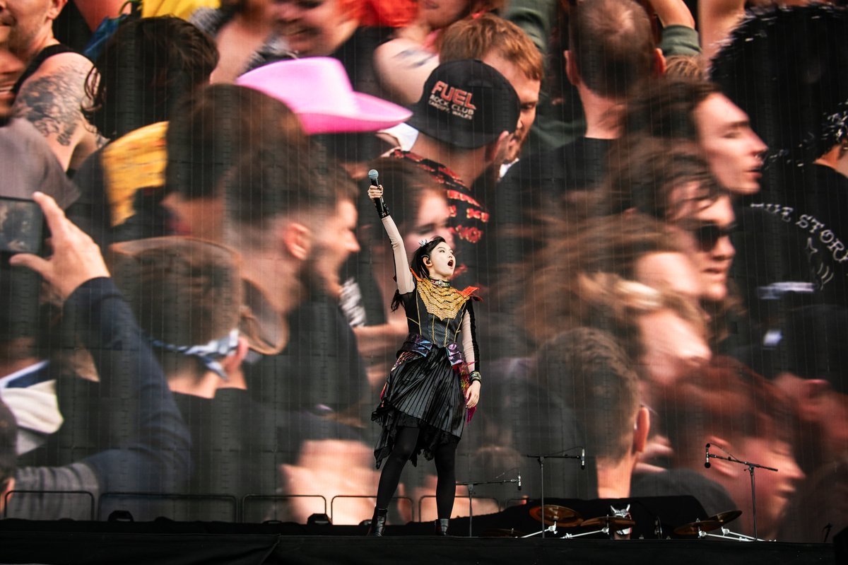 rocksound's tweet photo. BABYMETAL, Download Festival 2026  

LIVE REVIEW: “We are so happy to be back in Download… with sunshine!” SU-METAL smiles as BABYMETAL takes to the Apex Stage. Donington Park looks a little different right now than it did last time the trio were here. Back in 2024, their main stage set was cut short due to rain of biblical proportions, but today they’re back, and with nothing more than a light breeze to distract from their explosive antics. There’s one question they have to ask before that happens, though: “Are you ready to headbang?” The answer is a resounding yes, with the movements being made across the fields during ‘BABYMETAL DEATH’ guaranteeing an influx of chiropractor visits come Monday morning. After that, ‘PA PA YA!!’ and ‘METALI!!’ gets even the sleepiest of festival goers to their feet, and as the carnage ensues in front of them, SU-METAL, MOAMETAL and MOMOMETAL feed off of every last drop of intensity. Each note is pitch-perfect, and every movement is precise, whether they’re at their most blisteringly heavy or their most sugary sweet; the trio’s towering momentum doesn’t dip for a second. By the time we reach the pulverising likes of ‘Gimme Chocolate!!’ and ‘Headbangeeeeerrrrr!!!!!’, the sing-alongs are loud enough to trouble your eardrums and the vibes are at an all-time high.  For this one hour of power, Download Festival undoubtedly belongs to BABYMETAL.  

✏️ Maddy Howell 
📷 Carla Mundy