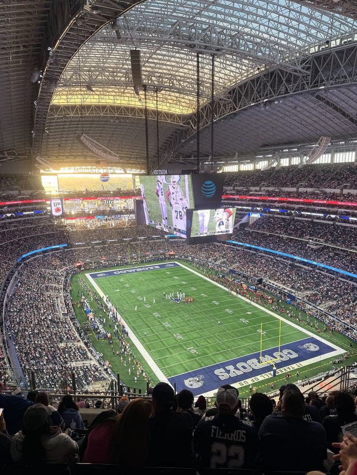 arinzechukwum_'s tweet photo. AT&T Stadium: Another Architectural Engineering Marvel by the Americans

​America keeps proving why they are the absolute best in the world when it comes to sports entertainment. It’s genuinely hilarious how they rebranded and reconstructed a massive American football dome in under six months just to meet strict FIFA standards for the World Cup.

​AT&T Stadium (temporarily renamed "Dallas Stadium" due to FIFA’s strict anti-sponsor rules) is an absolute titan of modern engineering. Built for a staggering $1.3 billion by Dallas Cowboys owner Jerry Jones, this 3-million-square-foot monster in Texas is officially the largest roofed stadium on earth.

​While it comfortably seats 80,000 fans, its flexible design allows it to expand to over 100,000 capacity. The arena is structurally supported by two of the longest single-span steel arches on the planet, features retractable glass walls, and is famous for its legendary, 1.2-million-pound Mitsubishi HD video board hanging directly over the center circle.

​But what makes it truly fascinating right now is how it completely transformed its identity to host elite international football, like the Netherlands vs. Japan match tonight.

​Because the stadium permanently uses artificial turf for the NFL and FIFA strictly demands real grass, engineers spent over 45,000 intense man-hours executing a high-tech pitch overhaul. They hauled in 15,000 tons of material, starting with subsurface ventilation and irrigation networks laid right over the concrete floor, followed by layers of specialized sand.

​They then brought in 24 refrigerated trucks carrying massive rolls of premium hybrid Kentucky bluegrass and ryegrass grown in Colorado. To make the pitch sturdy enough to survive nine grueling World Cup matches, specialized machinery literally stitched millions of synthetic nylon fibers directly into the natural sod.

​The absolute coolest piece of wizardry here is how they keep the grass alive inside a closed dome. Because the roof blocks vital sunlight, they installed a groundbreaking, automated grow-light system suspended directly from the ceiling.

​When turned on, these massive overhead rigs bathe the pitch in a vibrant, glowing pink hue to power photosynthesis. On match days, the entire light system is hoisted 290 feet into the rafters completely out of the fans' sightlines, and once the final whistle blows, they are lowered back down to nurse the grass.

​Just like SoFi, this entire engineering feat is temporary. Once the World Cup wraps up, the hybrid grass will be entirely recycled, and the stadium will shift right back to its standard synthetic turf just in time for the NFL season. The sheer level of flexibility and execution is unreal.