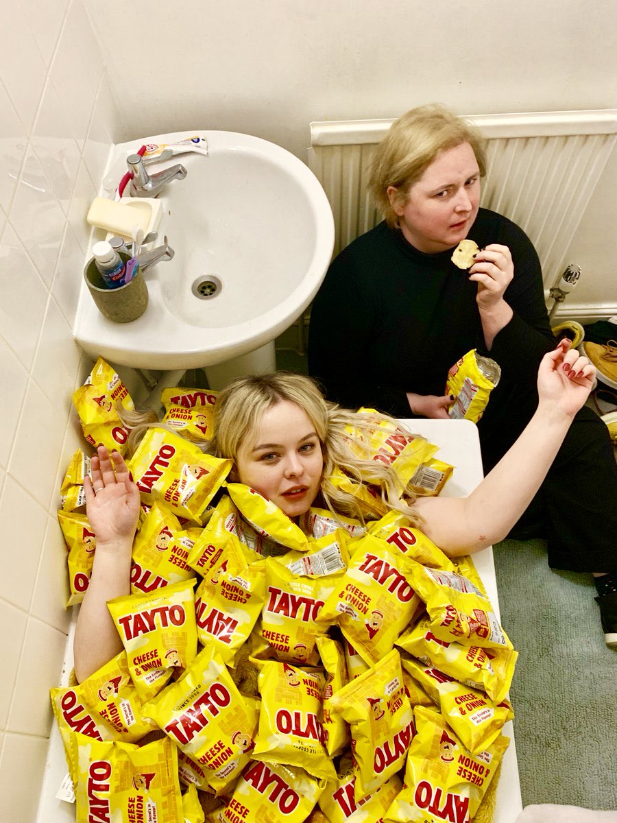 allthingsnicmc's tweet photo. Today is International Bath Day 🛁 

📸 Nicola Coughlan in a tub full of Tayto with Siobhán McSweeney eating some Tayto https://t.co/vy40Ofbfk7