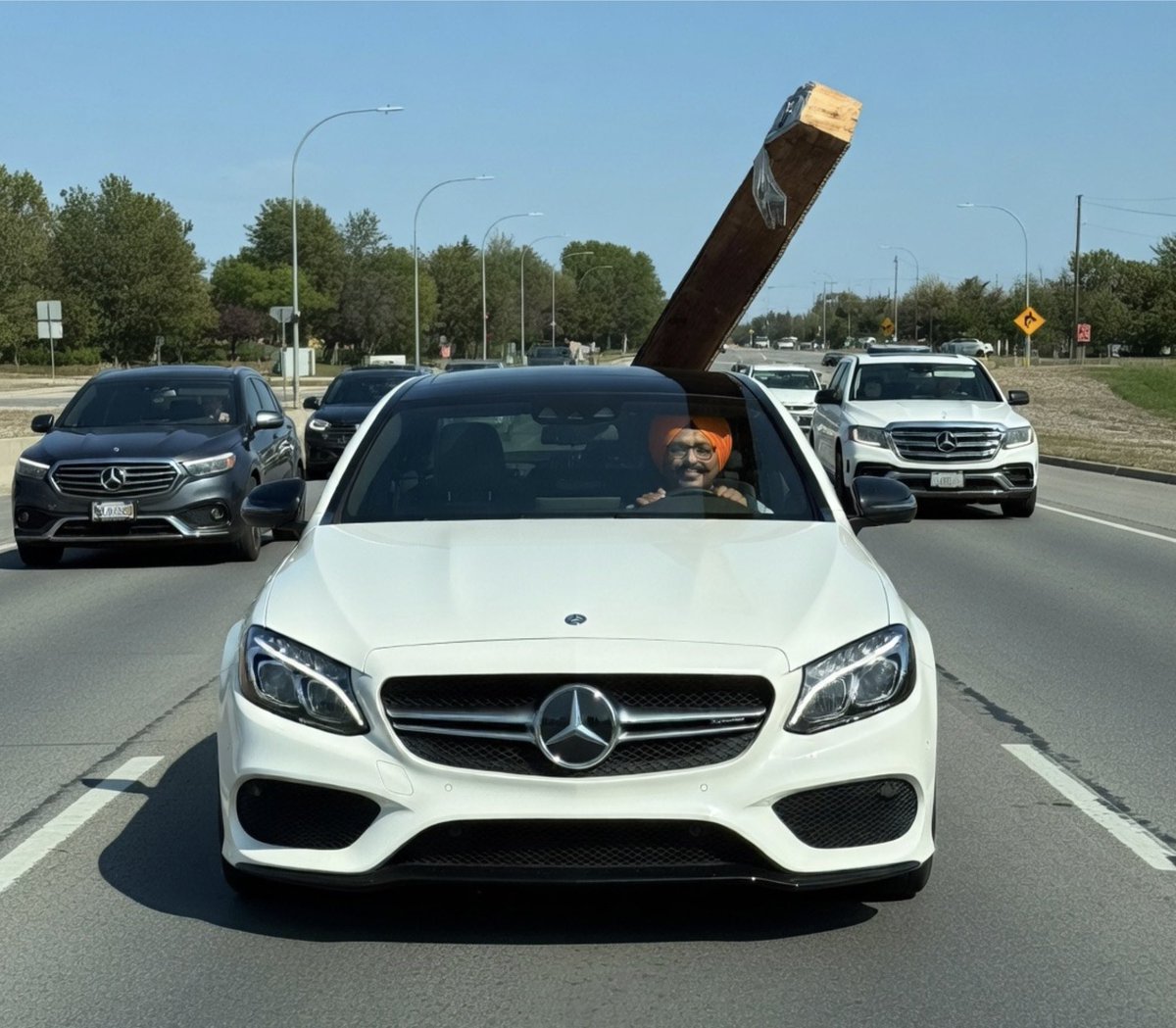 RajdeepSinghCA's tweet photo. Raj transporting big wood pillar to new Dunking Deep Donuts.

I’m finding my sunroof of Raj Mercedes Benz is great anchor for wood. https://t.co/wGXMlsUIvh