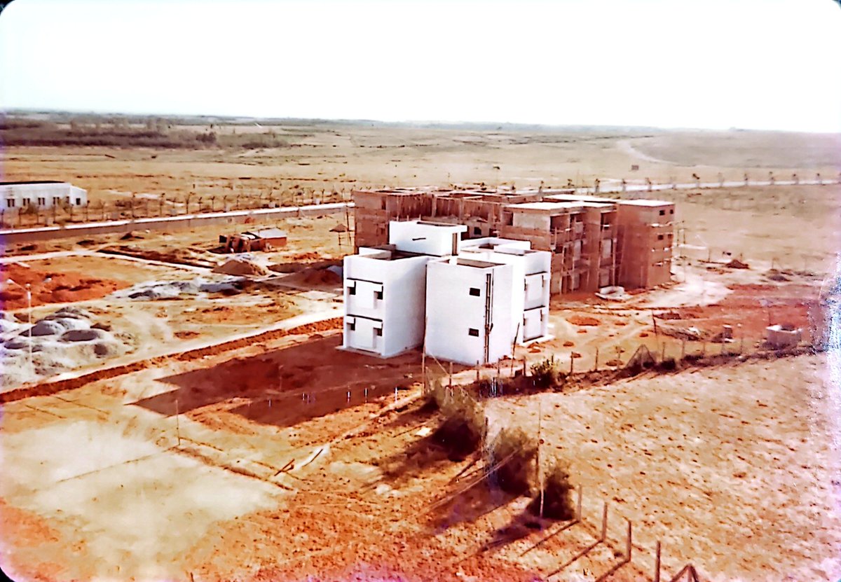surnell's tweet photo. KEONIC City (now called Electronic City) in 1984-86 the compound that you see is where today's elevated road's phase 1 exit terminates. @ELCITA_IN 
It was an empty God forsaken land then. NTTF and C-DOT occupied the first two plots on Hosur Road. https://t.co/K76sTkr0Rx