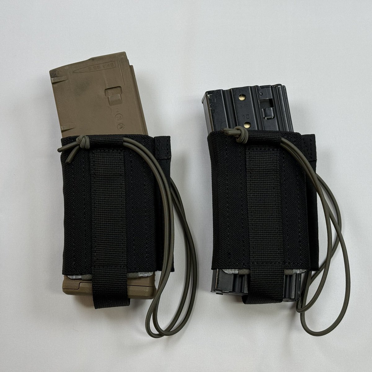 nylonworks's tweet photo. 極めて実戦を意識した弾倉用脱落防止システムを製作しました。銃本体と接続し靴下のように弾倉へ装着する設計となっています。(1/3) https://t.co/wb9QQcOG4o