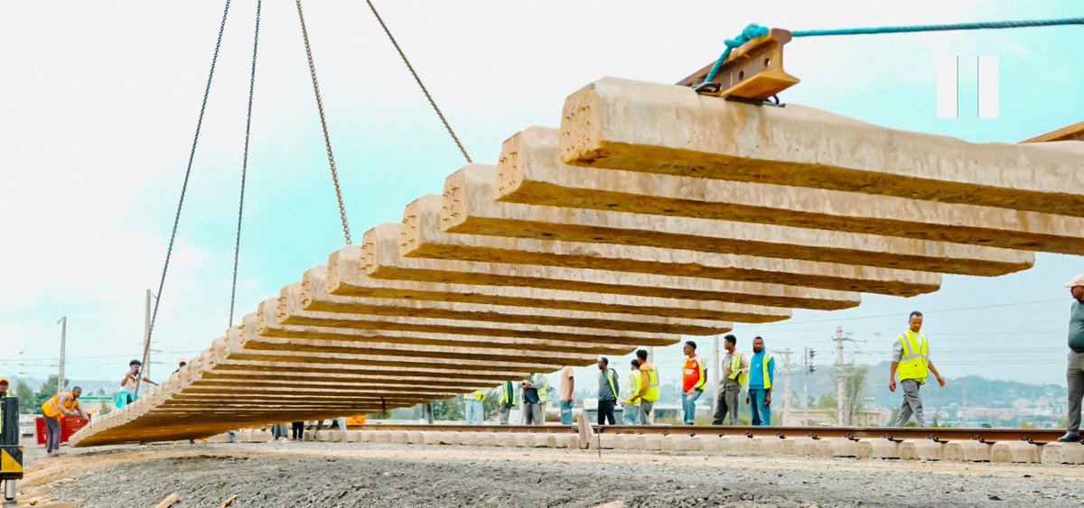 TakeleUma's tweet photo. From single  sleeper laying to assembled track installation – we’re picking up momentum, one step at a time. 

For  months , our track crews mastered the art of single-track sleeper laying across the Ethio-Djibouti Railway. That foundation taught us the value of precision, patience, and incremental progress – and now, it’s paving the way for something bigger.

We’ve recently begun using lifting cranes to install assembled track-sleeper units, a major leap in efficiency and coordination. And soon, we’ll be rolling out commercial track-laying machines – a game-changer for our infrastructure journey.

Every small step counts. Every lesson learned builds the future.

Proud of the team for pushing boundaries and raising the bar.