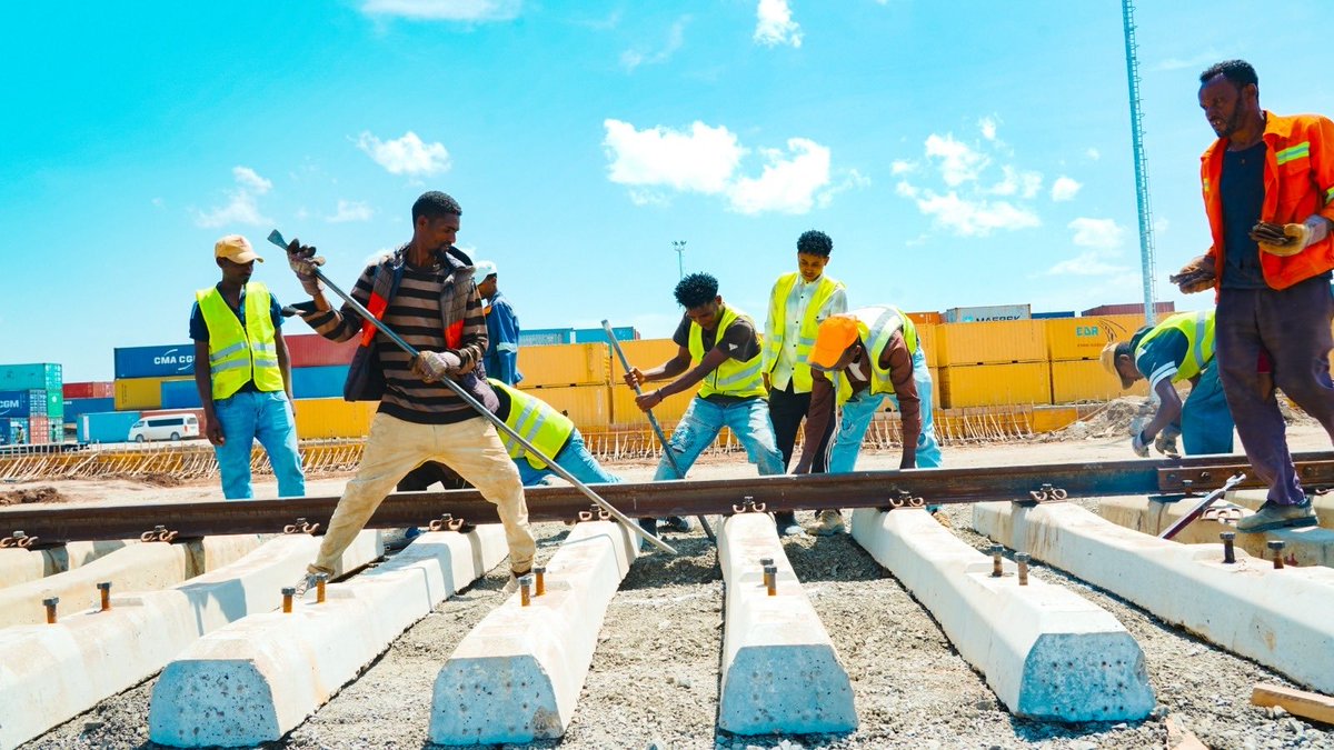 TakeleUma's tweet photo. From single  sleeper laying to assembled track installation – we’re picking up momentum, one step at a time. 

For  months , our track crews mastered the art of single-track sleeper laying across the Ethio-Djibouti Railway. That foundation taught us the value of precision, patience, and incremental progress – and now, it’s paving the way for something bigger.

We’ve recently begun using lifting cranes to install assembled track-sleeper units, a major leap in efficiency and coordination. And soon, we’ll be rolling out commercial track-laying machines – a game-changer for our infrastructure journey.

Every small step counts. Every lesson learned builds the future.

Proud of the team for pushing boundaries and raising the bar.