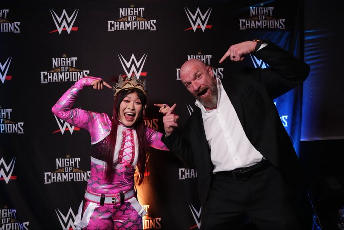 Cory_Hays407's tweet photo. Queen Iyo with Triple H backstage at #WWENOC https://t.co/jcVGh06KLd