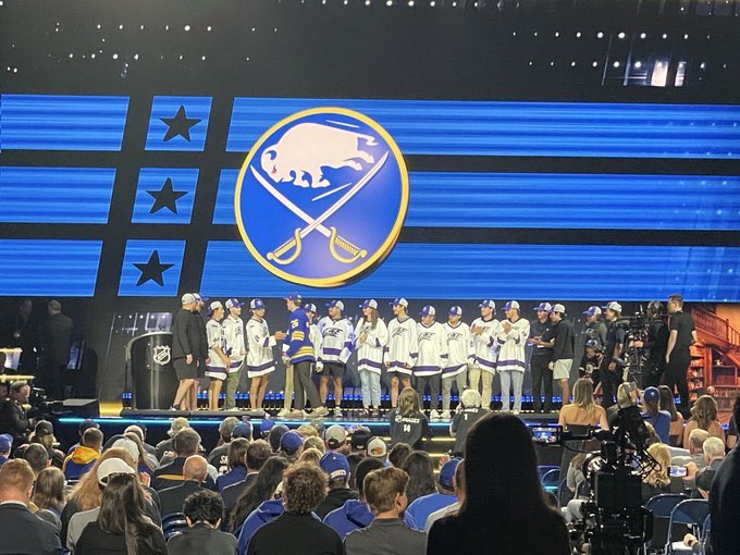 NiagaraACHAM2's tweet photo. Thank you to the @BuffaloSabres for inviting Shannon Burden and  our team to announce the 124th pick of the 2026 @NHL draft in honor of our late brother and teammate Bradly Burden. #BB20💜🦅 https://t.co/7Tgx0syTKD