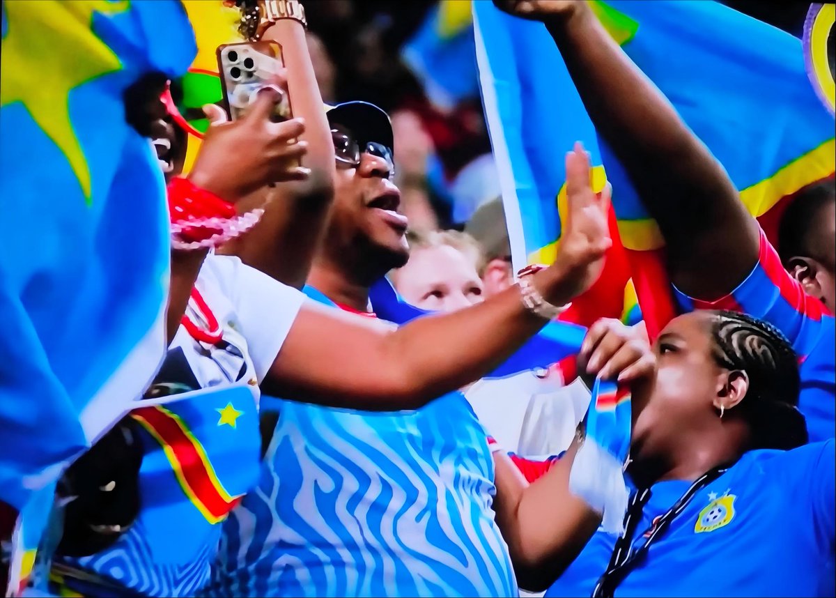 MassMeboya's tweet photo. Quand le bleu, jaune et rouge colonise l'espace visuel mondial &amp; que le « Debout Congolais » résonne dans les arènes modernes, c’est une nation digne qui s’affirme. Une diplomatie publique inégalée qui redessine notre réputation globale. La tête haute ! 🇨🇩🌍 #RDC #CoupeDuMonde https://t.co/19DSXWyxC8