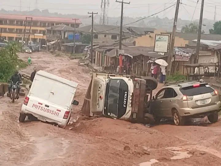 imran_services's tweet photo. Imagine staying in a community for almost 21 years of your life, and this is how their road has been since you moved in and it keeps getting worse. 

That's the fate of almost every place in Ogun state.

 This is Adiyan, one of the outskirts of Ogun state, and I have lived in this area for 21 years of my life. The road has been like this and keeps getting worse day by day.

 You'll think only the lower class stays in this area, but no, there are lots of well-to-do men living in this environment. 

Some years back, there was a Ghanaian man in the area and still there who ran one of the prestigious secondary schools in Ogun state. Students were coming from different parts of Lagos and Ogun state, and they had many school buses conveying students to and fro.

 However, the buses started getting bad because of the state of the road.

 He went to the leaders in the community to fix the road, rumours had it that he requested a fee to be charged from every transporter, and a percentage would be paid to him, while some said he requested for the road to be named after him, so they refused and didn't allow him to fix the road.

 Of course, his business suffered from it, and many people started withdrawing their students. I really doubt if the school is still functioning till date. 

He just wasted resources; you needed to see what he built. I forgot to add that he was running both a day and boarding school, so you should imagine how big the school is.

 The people that stopped him from fixing the road then are probably now old and can't go out, and their children can't come to visit them obviously because the road is bad.( We all are suffering from the selfishness).

There was a time some people came for a party in the area, and they couldn't get to their destination because their car kept breaking down due to the road. So they stopped on the road, rented chairs, sat there, and ate the food they were taking to the party right there.

If you use the road for the first time and you're like two - three months pregnant, there's probability that you might have a miscarriage, yes, it's that bad.

Below is the picture of what the community looks like, the person that took the picture took it on Sunday morning, this is the result of the rain that fell Saturday night/Sunday morning.

I still saw that bus that fell in the middle while on way to church and when I was going back home.

PC: Adaramola abiola Philip