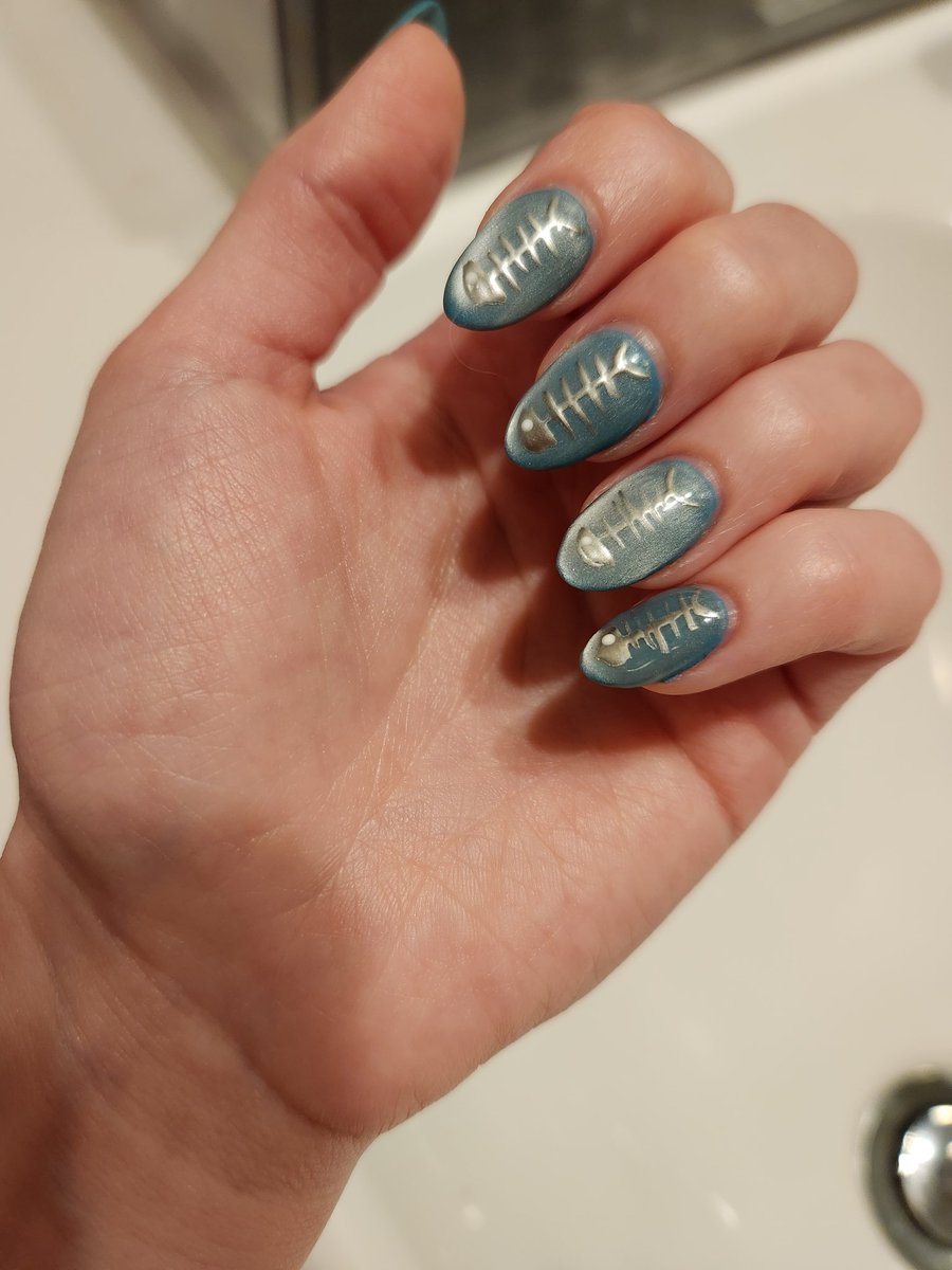 anna_chimene's tweet photo. i always have some bullshit on my nails nowadays &amp; i asked my nail tech if he had ever painted fish skeletons before. he just sighed like "anna most of the stuff you have me do i've never done before". anyways here's the fish skeletons https://t.co/2NyY2j30zf