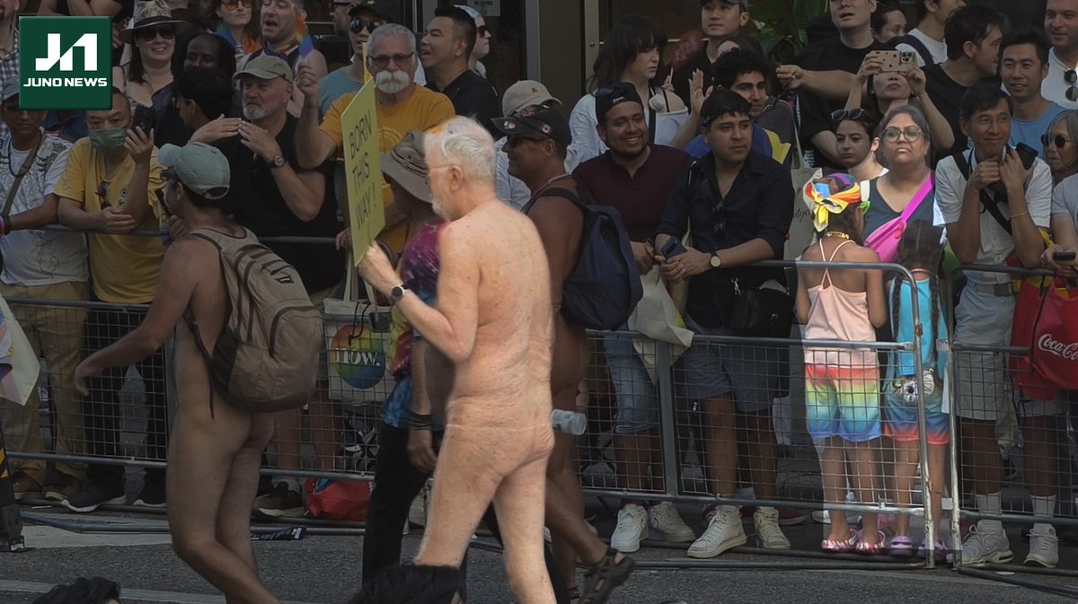 junonewscom's tweet photo. Disgusted mother shields the eyes of her two children as a parade of naked men walks by. https://t.co/Kwyzp1srlL