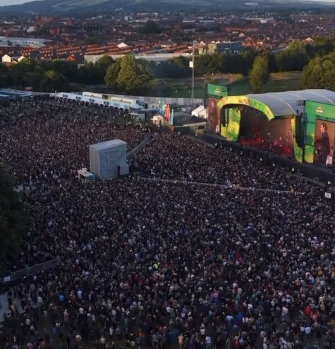 cureation's tweet photo. Stunning aerial images of @thecure's show in Belfast, Northern Ireland, as night falls with the upcoming Full Strawberry Moon 🌕  Where we got 3 tour debuts, Cold, 100 Years and Never Enough! https://t.co/vO46i345rk