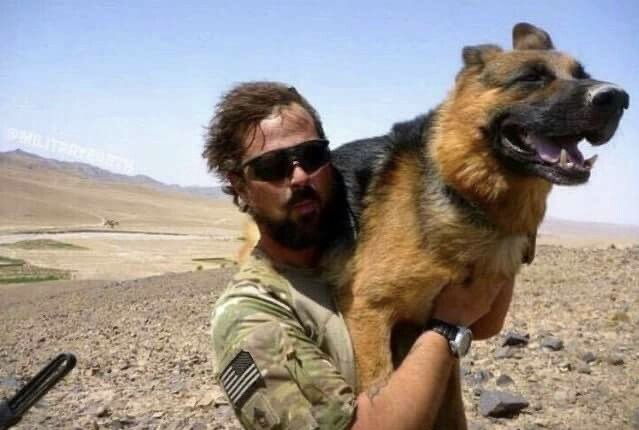 Puppieslover's tweet photo. This soldier carried his service dog down a mountain because it was 117 degrees &amp; the rocks were burning his feet. https://t.co/Lvzz1u25ti