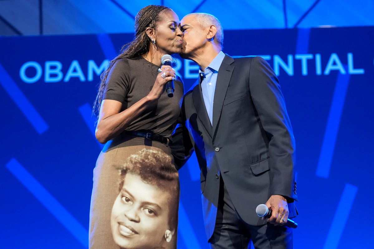 TheCut's tweet photo. Michelle Obama’s clothes have always sent a message, and the custom Acne Studios skirt she wore during a reception at the Obama Presidential Center yesterday was no exception. The skirt featured a portrait of Obama's late mother, Marian Robinson, who passed in 2024. https://t.co/GDi6YNYWHk