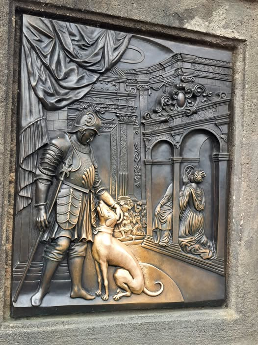 woofknight's tweet photo. In Prague and on the Charles Bridge there is a plaque. And on this plaque is a man with a dog. The dog is polished and shiny because everyone who sees it, for centuries, rubs the dog....because he's a really good boy! https://t.co/SEQ8uBstq6