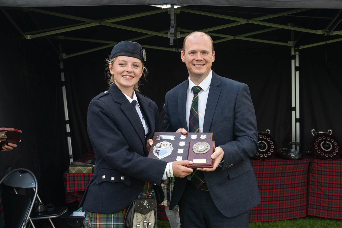 Minister Lyons awarding a prize at the UK Pipe Band Championships 2026 in Grove Park.