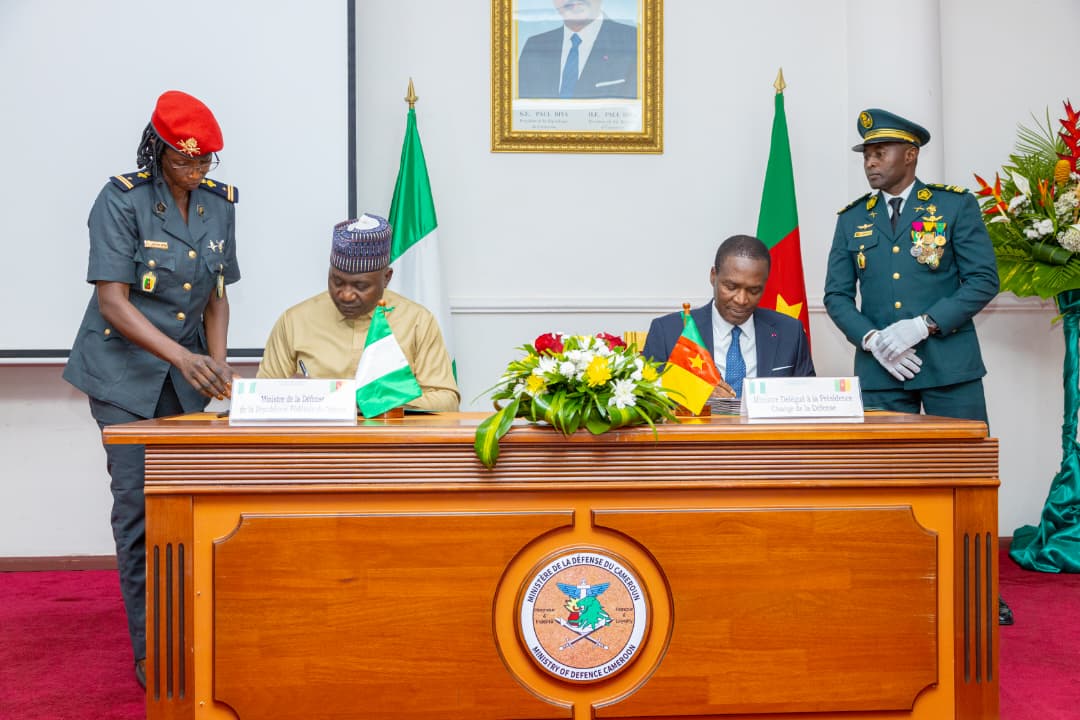 Nairametrics's tweet photo. PHOTOS: Minister of Defence, General Christopher Gwabin Musa (Rtd.), OFR, signs border security pact with Cameroon's Minister Delegate at the Presidency in charge of Defence, Joseph Beti Assomo, in a ceremony held in Yaoundé. https://t.co/DA5J5Ys8pC