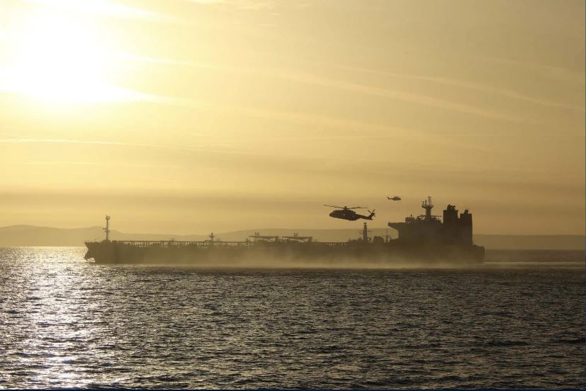 RNASCuldrose's tweet photo. A Merlin Mk2 helicopter from RNAS Culdrose supported the @RoyalNavy operation on Sunday to board a sanctioned shadow fleet oil tanker in the English Channel. The crew from Merlin Helicopter Force provided oversight &amp; search &amp; rescue cover. #Cornwall Read https://t.co/gonYBsrBTb https://t.co/EBlsBc3U2F