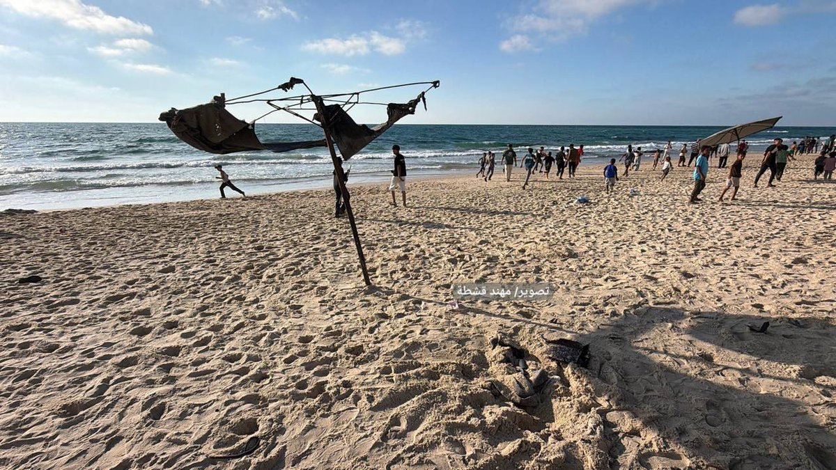 shameensuleman's tweet photo. 🟥 UPDATE NUMBER THREE | 17 JUNE 2026

🔳 MASSACRE ON THE BEACH
Journalists on the ground | Gaza Strip 

🔳 israeli warplanes continued flying intermittently across the skies of the Gaza Strip throughout the afternoon, with military aircraft repeatedly reported over multiple areas as attacks and aerial surveillance continued.

🔳 In eastern Khan Younis, israeli war criminal quadcopter drones dropped explosive barrels near the Bani Suheila roundabout, an area that has repeatedly come under fire despite civilians continuing to move through the area.

🔳 A powerful explosion was later reported in Khan Younis as residents documented ongoing aerial activity and attacks across the city.

🔳 In the Al-Mawasi area of Khan Younis, an israeli drone strike targeted civilians on Al-Rashid Street near Tayba Mobile.

▪️ Initial reports spoke of multiple injuries.

▪️ The toll was later updated to two Palestinians killed and a number of wounded following the attack.

▪️ The strike took place in Al-Mawasi, an area where hundreds of thousands of displaced Palestinians have sought refuge after being repeatedly ordered to move by the israeli war criminals.

🔳 Later, an israeli reconnaissance drone bombed Kafi (Sky View) near Al-Nas Roundabout in Al-Mawasi, south of Khan Younis.

▪️ Footage from the first moments after the strike showed the aftermath of the attack as emergency crews and civilians rushed towards the targeted area.

▪️ The bombing came amid continued drone activity, warplane overflights and attacks across Khan Younis throughout the afternoon.