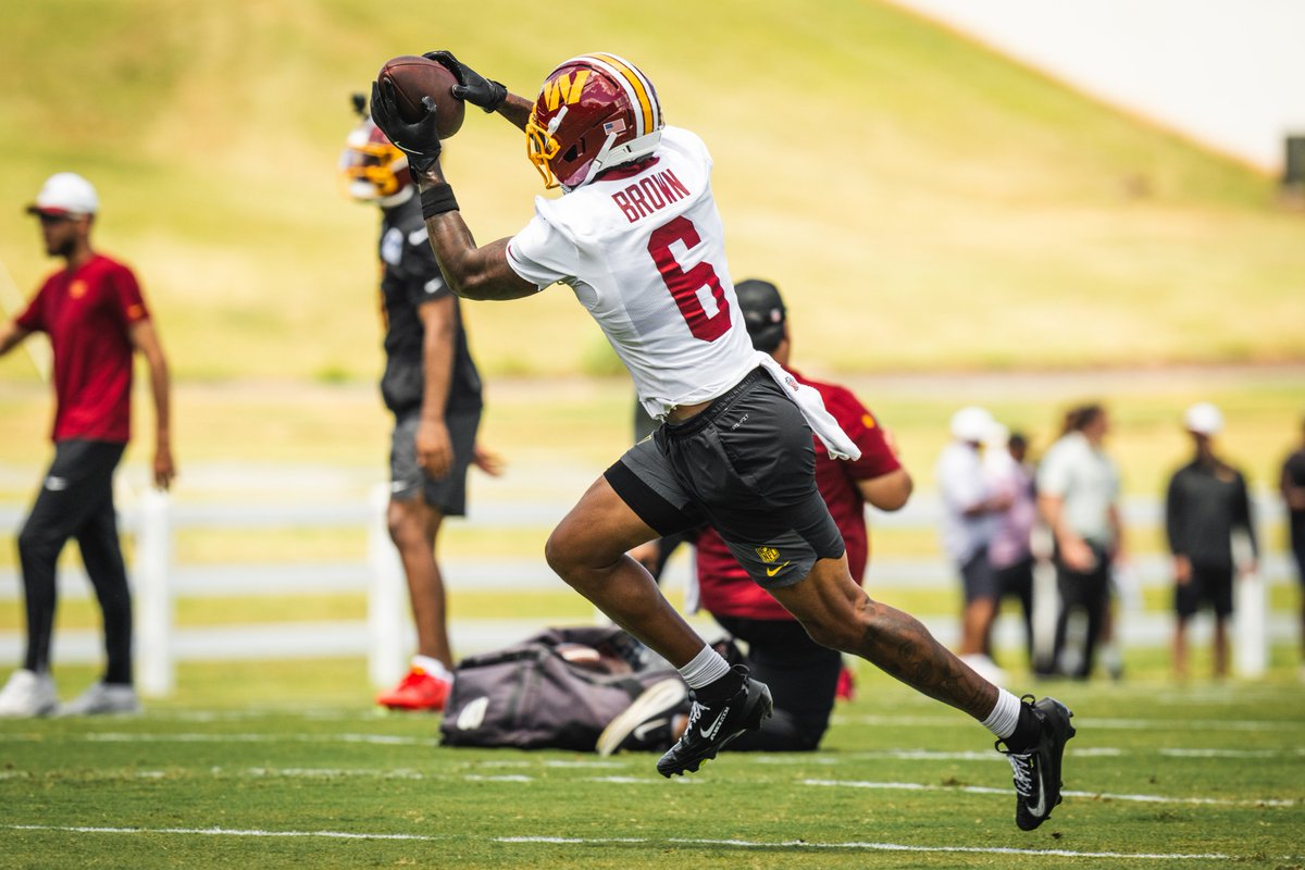 Photo. Dyami Brown catching a football. 