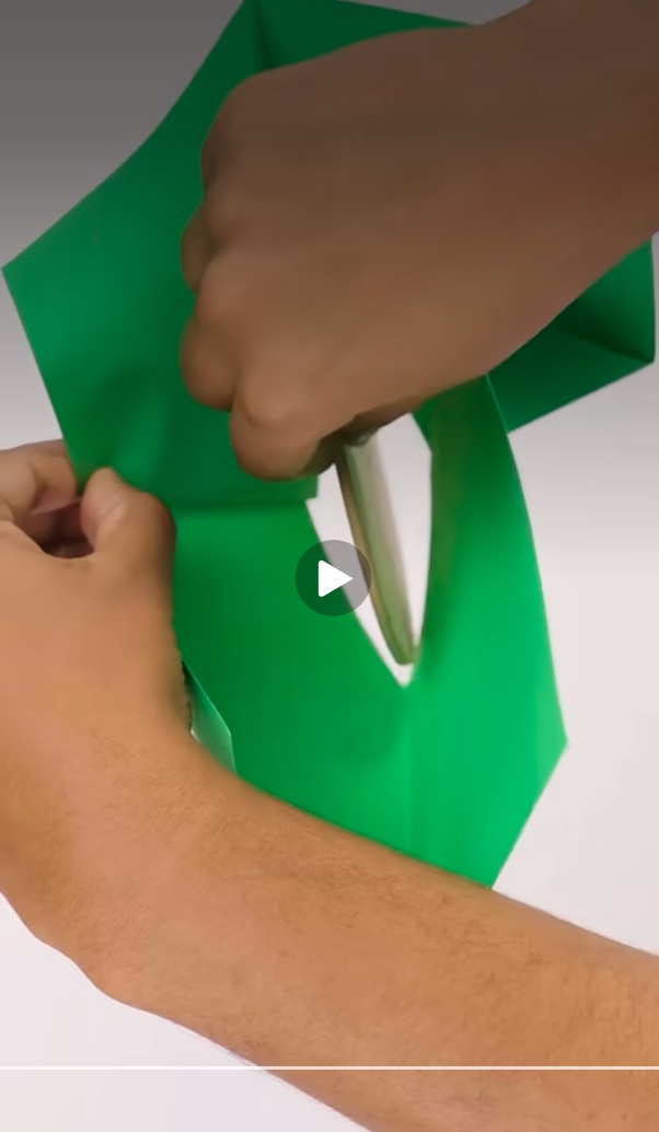 _Universal_7's tweet photo. But yes, what he is doing is exactly what I already mentioned.
Because the paper is flexible, when you fold it into a 3D structure, you can stretch the square hole into a diamond shape, where one axis gets shorter, but the other one gets longer, just like it is in this screen shot. I did take note of that.

So, if you keep that paper in 3D formation, this would be possible. You basically increase the size of one axis, at the expense of making the other axis shorter.
But that will not work if you hold the paper flat, as it was in the original video.