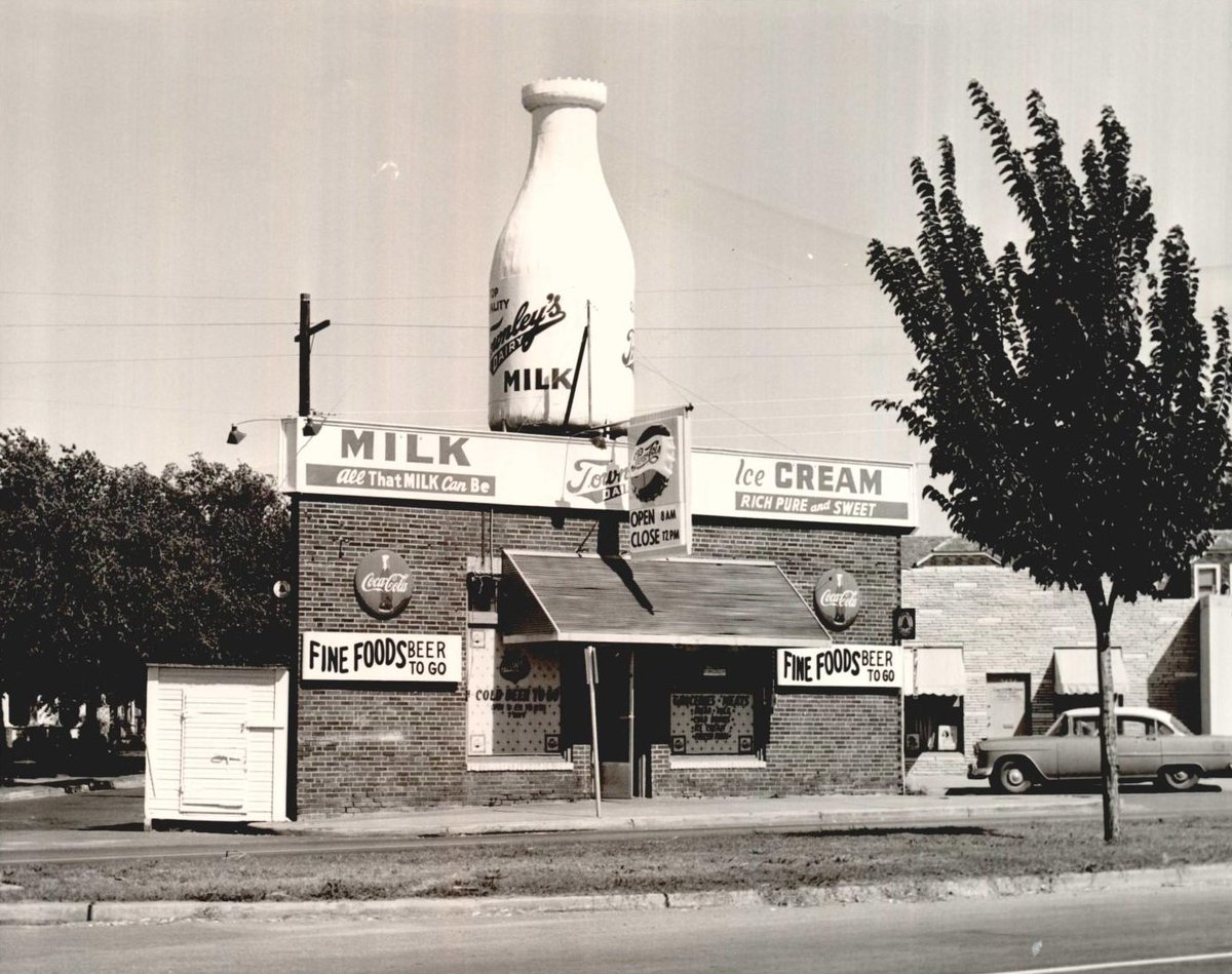 okhistory's tweet photo. Then and Now: Route 66

The Milk Bottle Grocery in Oklahoma City is hard to miss! The brick building was finished in 1930, and the milk bottle was added to the top around 1948. It is made of sheet metal.

#Route66 #MotherRoad https://t.co/dqiuAqphHR