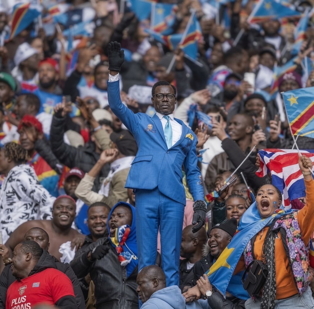 Global_Folder's tweet photo. Superfan Mboladinga, known as Lumumba Vea for his statue-like pose honoring independence hero Patrice Lumumba, missed the Houston opener of DRC vs Portugal due to visa delays https://t.co/7zrDpKuJN6