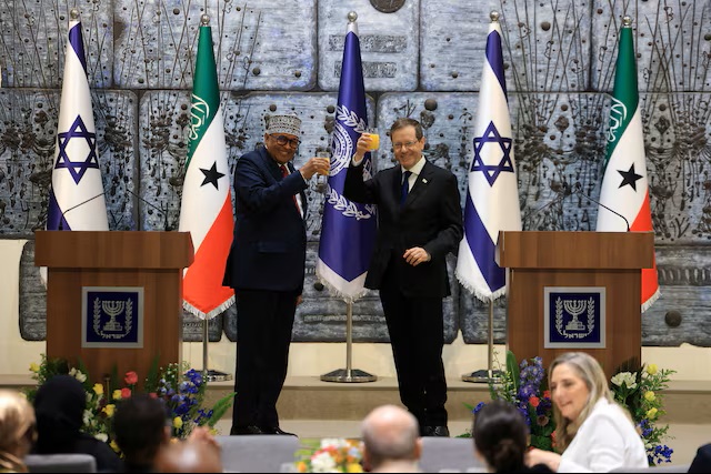 addisstandard's tweet photo. #Somaliland receiving #Israeli military training but not in talks for base, minister says

Israel has no base in Somaliland but is training ​its police and military forces, Somaliland's Defence Minister Mohamed Yusuf Ali said on Wednesday, as the ‌breakaway territory appealed for Israeli investment in agriculture and other sectors.

Yusuf Ali was part of a large delegation to Israel this week to mark Somaliland President Abdirahman Mohamed Abdullahi's first official visit, after Israel became the first country to formally recognise Somaliland as an independent ​state in December.

#Somalia rejected Israel's recognition of Somaliland and termed it a "deliberate attack" on its sovereignty. The Somali Guardian reported on Sunday ​that Israel had opened an intelligence base in Somaliland and there were discussions over the possible establishment of an ​Israeli military base.

Speaking to Reuters on the sidelines of a business forum organised by Israel's foreign ministry in #Tel_Aviv, Yusuf Ali dismissed reports that Israel was in negotiations to establish a military base in the territory as "rumours".

"There is no Israeli military presence or military ​bases in Somaliland," he said. "But Israel is helping Somaliland ... they are supporting to train some of our police and ​military."

https://t.co/bDQG1O4NwR