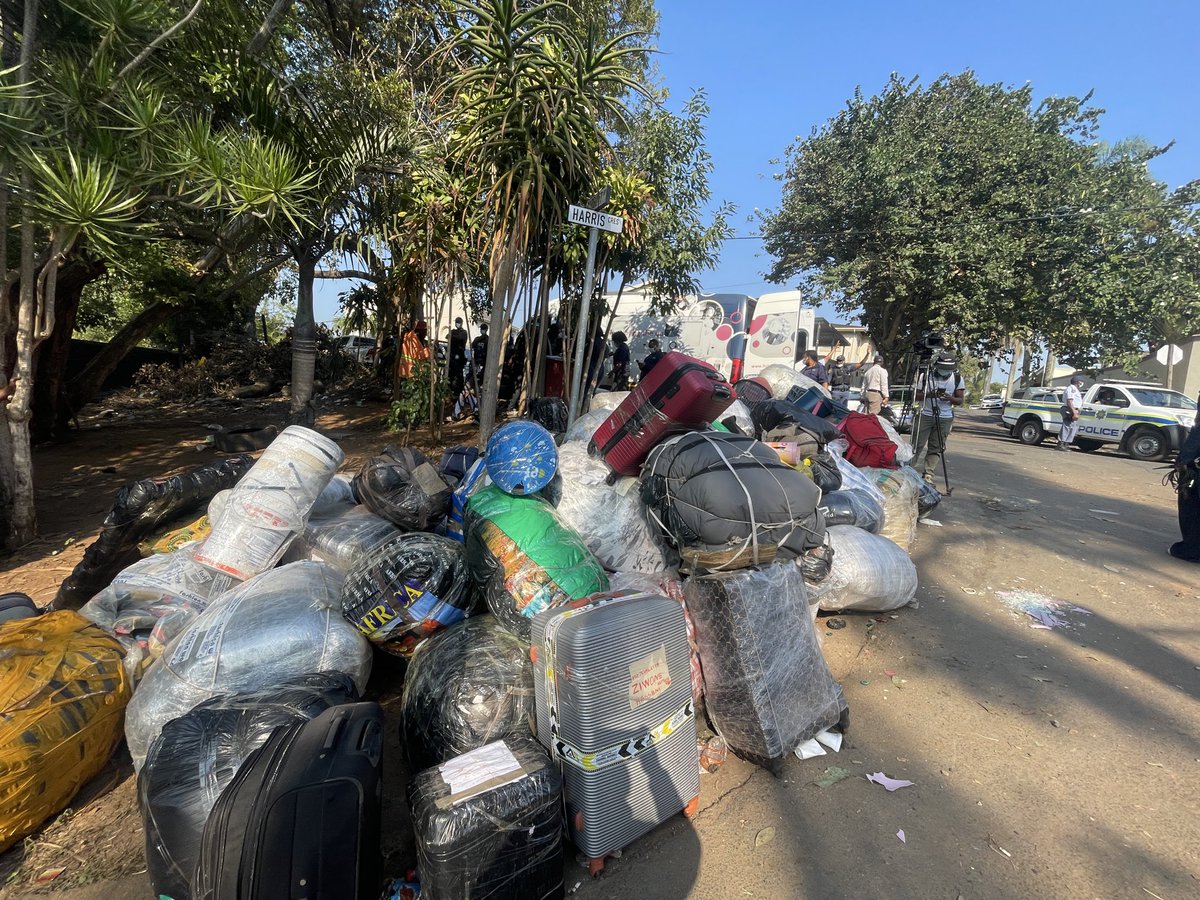 Logic_Malinga's tweet photo. Police have maintained a heavy presence at Durban’s Sherwood Hall transit site as the repatriation of Malawian nationals continues. A fourth bus has already departed today, while more migrants are being processed and verified before returning home. #sabcnews https://t.co/ifdw9Z4vVH