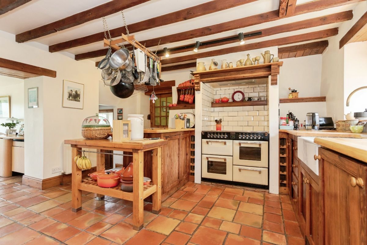 homeuk's tweet photo. Walk into the sitting room and look up: a vaulted ceiling laced with timber trusses, a galleried mezzanine tucked under the apex, light pouring across stripped floors. Middle Farm is a proper Teesdale stone farmhouse in the village of Mickleton, with a warmth you cannot fake.

The terracotta kitchen runs to a cream range, a Belfast sink and a walk-in pantry, then opens to a glass-walled garden room where the fields roll away in a patchwork of grazing and big northern sky. Two plots totalling about 0.62 acres, with fruit trees, a walled terrace and stone outbuildings. £550K, a few minutes from Barnard Castle.

https://t.co/qjRHnJ64Z9 ❤️

For sale with @anthonyjones_uk on Home