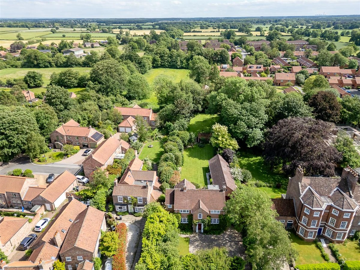 homeuk's tweet photo. Orchard House sits down a private drive off Heslington main street: a handsome red-brick family home behind a fanlight door and a parquet hall. Dual-aspect living room, bay window, a log burner set in carved stone, and a sweep of south-facing lawn that runs back further than you expect.

Five bedrooms, a shaker breakfast kitchen, garaging and parking for several cars, plus a self-contained one-bed annexe for guests or grandparents. Two pubs, a cafe and a post office within a stroll, York University walkable, the city centre 15 minutes off. £1.25M for a proper village house.

https://t.co/okimJ9BOD6 ❤️

For sale with @hudsonmoody on Home