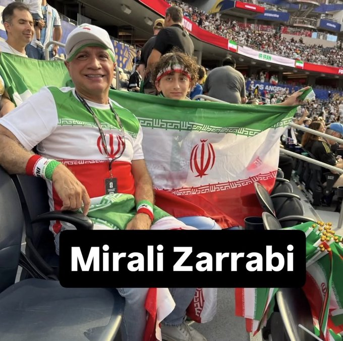 TheIranWatcher's tweet photo. 🚨 I mentioned that the only issue I witnessed at the stadium was an older Islamic Republic supporter behind me causing a disturbance and encouraging the child with him to harass others.

Thanks to Iranians online, he has since been identified and appears to have a history of causing trouble in Southern California.

He was identified as Mirali Zarrabi.

He's an openly gay hardcore Islamic Republic supporter and a doctor.

⚪ He's married to a man, a relationship that would NOT be allowed under the Islamic Republic's laws (even though a lot of clerics and supporters are undercover homosexuals). 
⚪ He appears to have two sons, even though the Islamic Republic he supports would deem his marriage unlawful and his family invalid.
⚪ He was previously arrested and charged in connection with a massive $250 million healthcare fraud and money laundering scheme involving fraudulent insurance billing. He was ultimately acquitted, while a colleague was sentenced to seven years in prison.

Involved in alleged criminal activities and an openly gay man (a crime in the Islamic Republic) supporting the regime? No one should be surprised. These people are full of contradictions and struggle with significant internal conflicts.