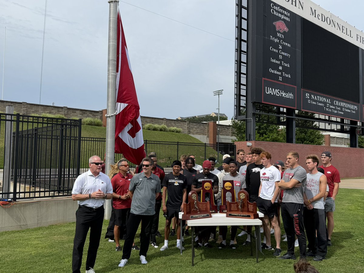 PigTrailNation's tweet photo. 52 did not last long! @RazorbackTFXC raising their new flag to celebrate the program’s 53rd National Championship! https://t.co/T8CkmeftTz