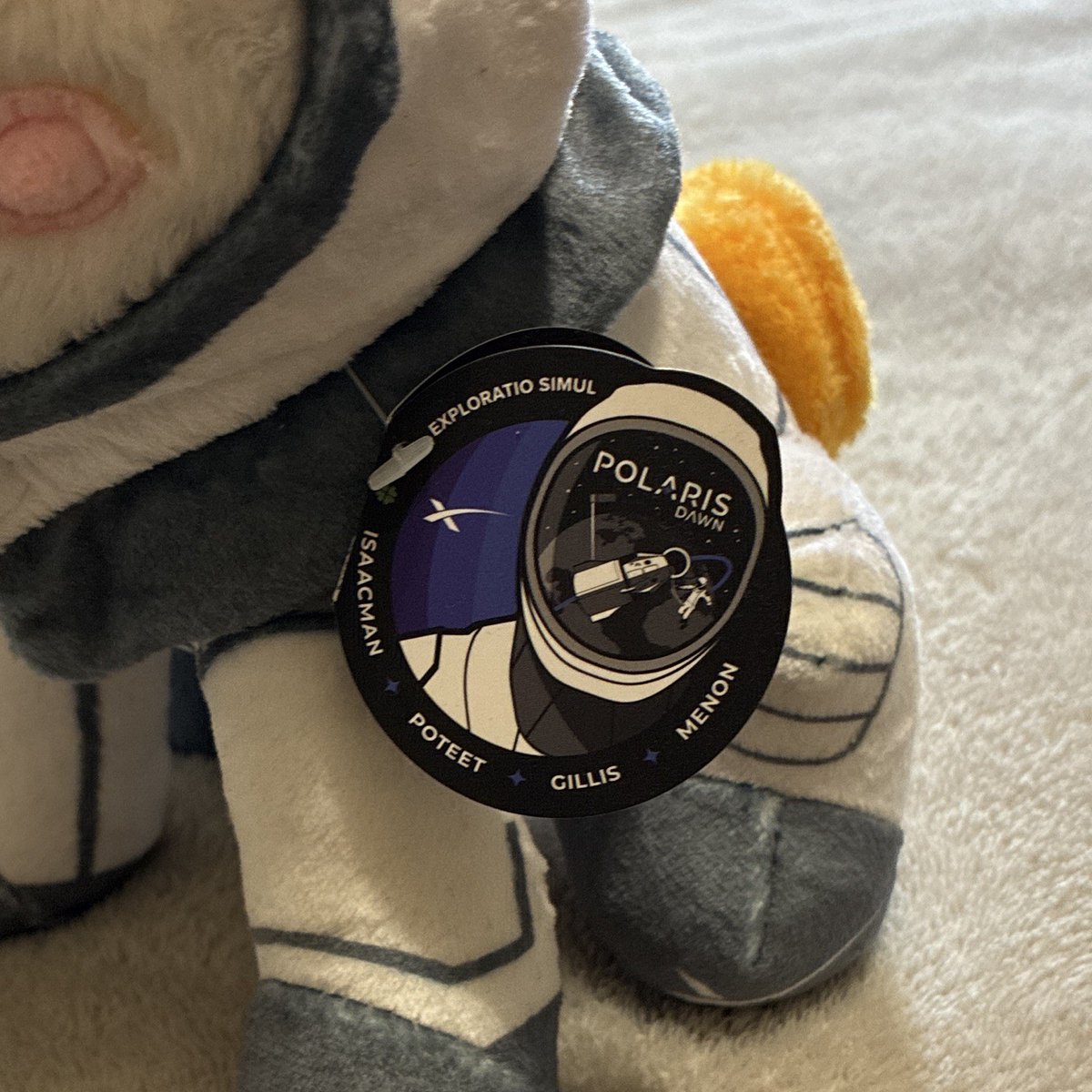 b___ane's tweet photo. They add the asteroid plush back on the site today with 2 key changes from the last time they released it.

1. The link this time literally ends in 'spacex-asteroid-mascot' instead of 'polaris-dawn-zero-gravity-indicator' 

2. The tag has been redesigned to feature a digitized version of asteroid holding a flag with the logo instead of @PolarisProgram branding.

Chances are we're gonna start seeing this new digitized mascot logo showing up on more and more promotional assets in the coming weeks and months.

https://t.co/jdJ6SvT8Pt