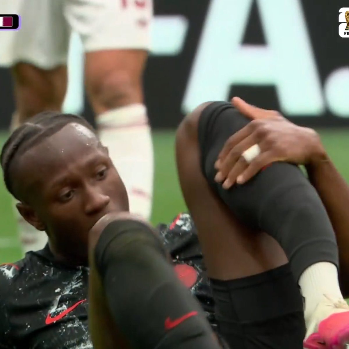 TouchlineX's tweet photo. 📸 - The Qatar player who made the tough foul on Ismael Kone is in tears as Kone is apparently injured. https://t.co/4mP9uWZbpc