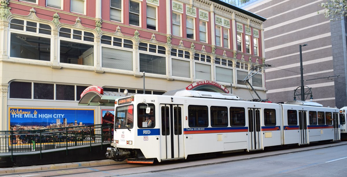 DRCOGorg's tweet photo. Congrats to Gary, a DRCOG photo contest winner! Their photo is of a @RideRTD light rail train next to a "Welcome to the Mile High City" sign at the 16th and California streets stop in downtown Denver. A great photo showing RTD transit service and the city's historical buildings. https://t.co/eQNZ3LuNtS