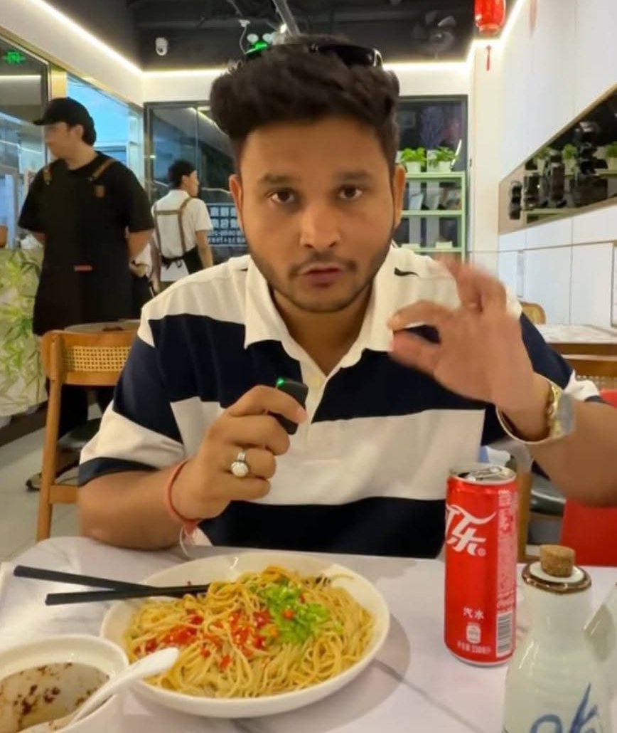 CuteAishwariya's tweet photo. An Indian traveler recently walked into a restaurant in China and ordered a simple plate of chow mein.

A few moments later, the meal arrived with an unexpected surprise — a complimentary Coke.

Confused, he asked the staff why an extra drink had been included when he hadn't ordered one.

The employee's answer caught him off guard.

“We noticed you chose the version without meat,” the staff member explained. “Since it costs us less to prepare, we added a Coke so you receive better value.”

The drink itself wasn't expensive.

What stood out was the mindset behind it.

In many places, customers carefully check bills to make sure they haven't been charged extra. Here, the restaurant voluntarily gave something back because they felt it was the fair thing to do.

That small gesture transformed an ordinary meal into a memorable experience.

People often talk about economic growth, technology, and infrastructure when discussing a country's progress.

But trust, transparency, and a genuine focus on customer satisfaction are just as important.

Sometimes, a nation's reputation isn't built by grand projects alone.

It is built by small moments where businesses choose fairness over profit and leave customers pleasantly surprised.